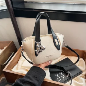 High end and niche solid color bag for women in 2024, new summer fashion crossbody bag, popular this year, portable bucket bag - Image 1